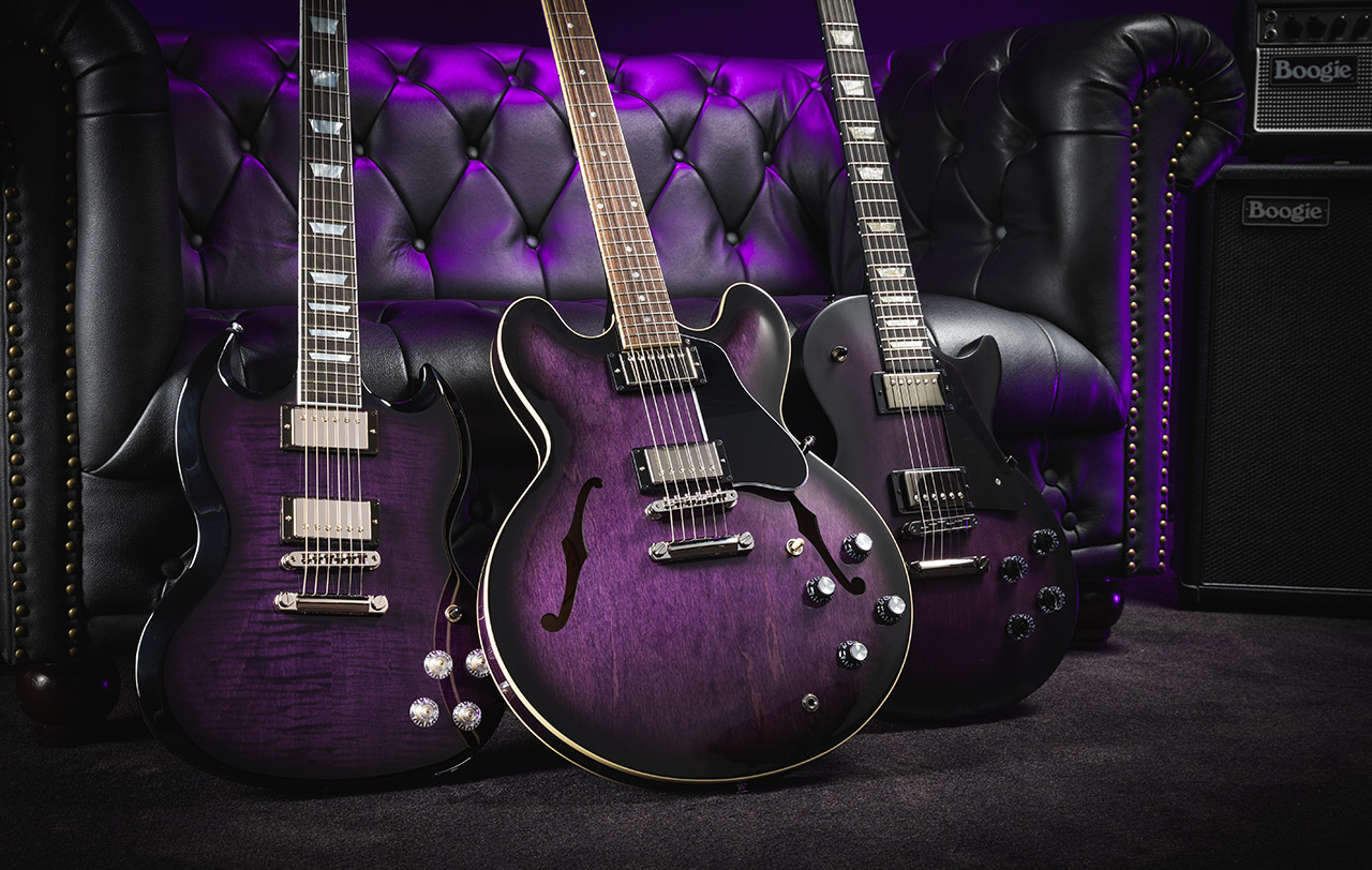 Gibson is at the forefront of innovation and timeless design, and the latest offerings are no exception. An additional three of Gibson’s most iconic models are now available in an exclusive Dark Purple Burst finish. These models include the versatile ES-335, the sleek SG Modern, and the refined Les Paul Modern Studio. Each guitar not only boasts a stunning new look but also delivers exceptional performance and quality. ES-335: The Timeless Tradition of Versatility The Gibson ES-335 DOT has been a cornerstone of the Gibson ES lineup since its debut in 1958, setting an unmatched standard in the world of guitars. This model features a pearloid dot inlay rosewood fingerboard on a hand-rolled Rounded "C" mahogany neck, reminding players of its rich heritage. The calibrated T-Type humbucking pickups paired with a hand-wired control assembly deliver the versatile Gibson ES tone that has been coveted for over six decades. The Vintage Deluxe tuners with Keystone buttons ensure tuning stability and precise intonation. They are combined with a lightweight Aluminum ABR-1 bridge and Stop Bar tailpiece anchored by steel thumbwheels and tailpiece studs. Now available in an exclusive Dark Purple Burst finish, the ES-335 continues to captivate players with its timeless appeal. SG Modern: A New SG For Modern Times The refreshed Gibson SG Modern merges contemporary updates with the classic SG design, creating a hybrid between an SG and a Les Paul. This model features an AA maple top and mahogany back, renowned for their resonance and sustain. The genuine ebony, 24-fret compound radius fingerboard, and asymmetrical SlimTaper neck provide fast and silky access to the highest frets. Calibrated Burstbucker Pro Alnico 5 humbuckers deliver powerful tones, while push-pull controls offer versatility, allowing players to switch between humbucker and single coil P-90 sounds. Upscale appointments include genuine mother-of-pearl inlays, Grover Rotomatic tuners, and clear Top Hat knobs. The SG Modern in Dark Purple Burst is a stunning addition to any guitarist's collection. Les Paul Modern Studio: The Legendary Les Paul Studio, Updated With Modern Refinements The Les Paul Studio has long been favored by guitarists for its combination of an Ultra Modern weight-relieved mahogany body and maple cap paired with simplified cosmetic appointments. The new Les Paul Modern Studio incorporates many enhancements from the Les Paul Modern, including a bound ebony fretboard with a compound radius for improved action and playability, a Modern Contoured Heel for exceptional upper-fret access, and black nickel hardware. Additional features include coil tapping, phase control, and pure bypass switching for ultimate tonal flexibility. The Les Paul Modern Studio in Dark Purple Burst comes with a soft shell case, making it a high-performance tone machine ready for any stage. Check Out the New Additions The exclusive Dark Purple Burst Collection brings a fresh, vibrant look to three popular models. Whether you’re a fan of the versatile ES-335, the sleek SG Modern, or the refined Les Paul Modern Studio, these guitars offer a unique blend of style and performance. Don’t miss your chance to own one of these stunning instruments, available only from Gibson.com in this exclusive finish. Elevate your playing experience with Gibson’s latest and explore the Dark Purple Burst Collection.