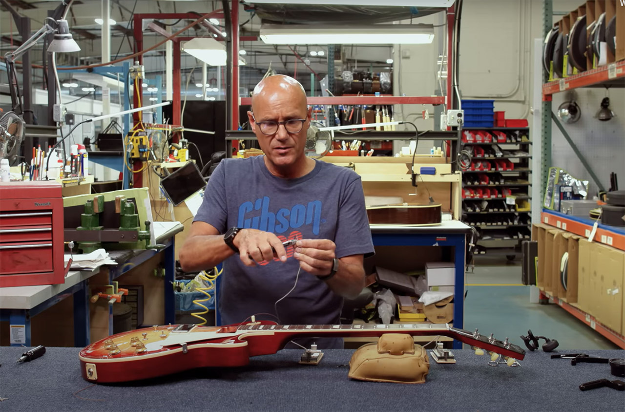 Jim DeCola changing pickups in a Gibson Les Paul guitar