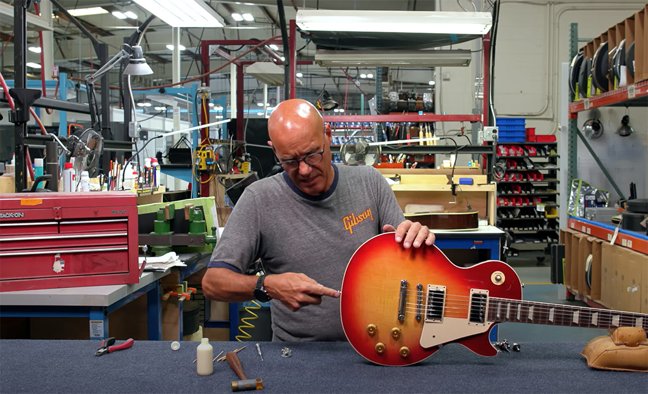 Jim DeCola installing strap locks on a Gibson Les Paul guitar